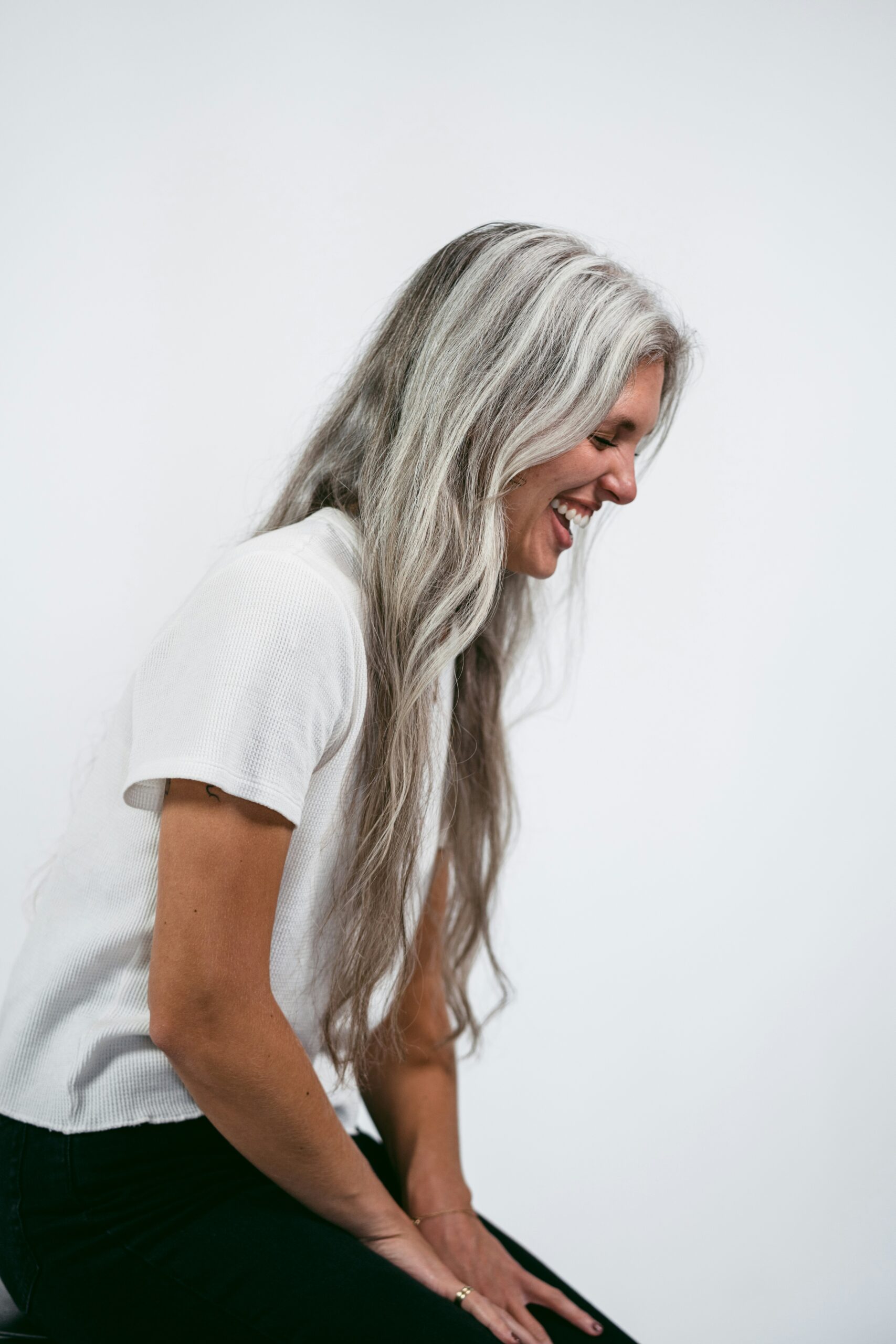 Woman smiling during an online Brainspotting therapy session in Ontario