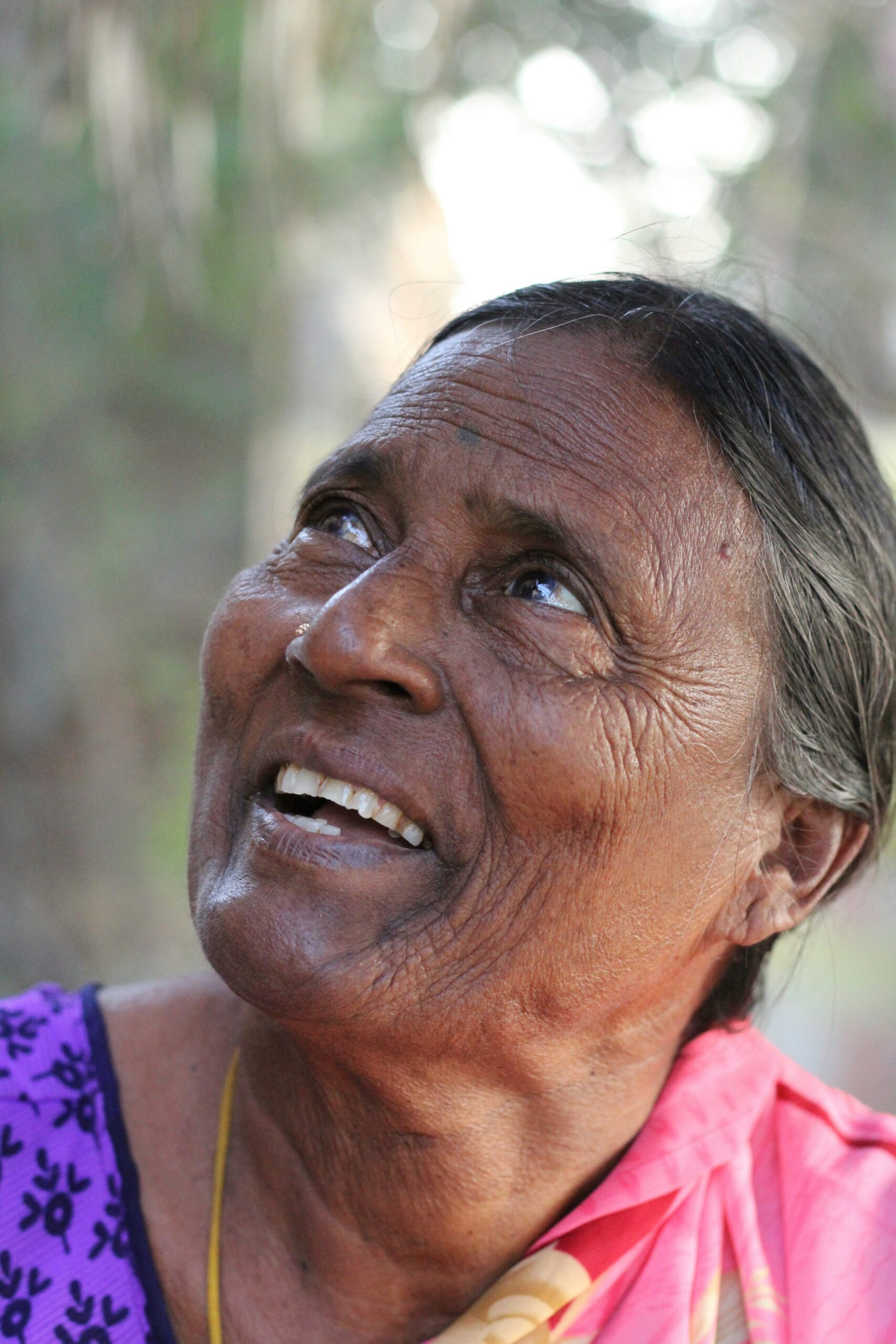 Woman looking upward during a Brainspotting therapy session, where eye position guides the work
